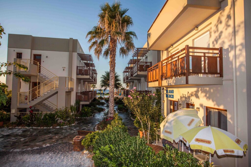 Apartments and flower-filled gardens at Ilian Beach, Rethymno